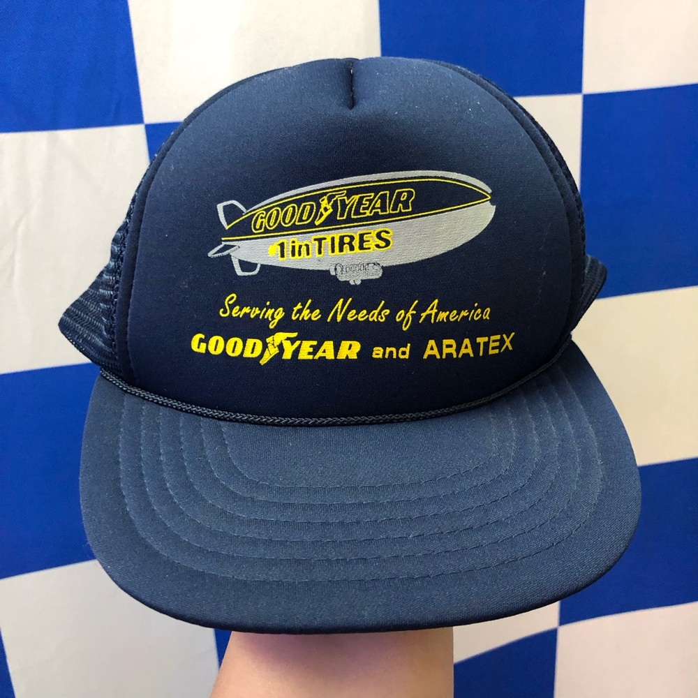 Navy and yellow vintage Goodyear blimp trucker hat
